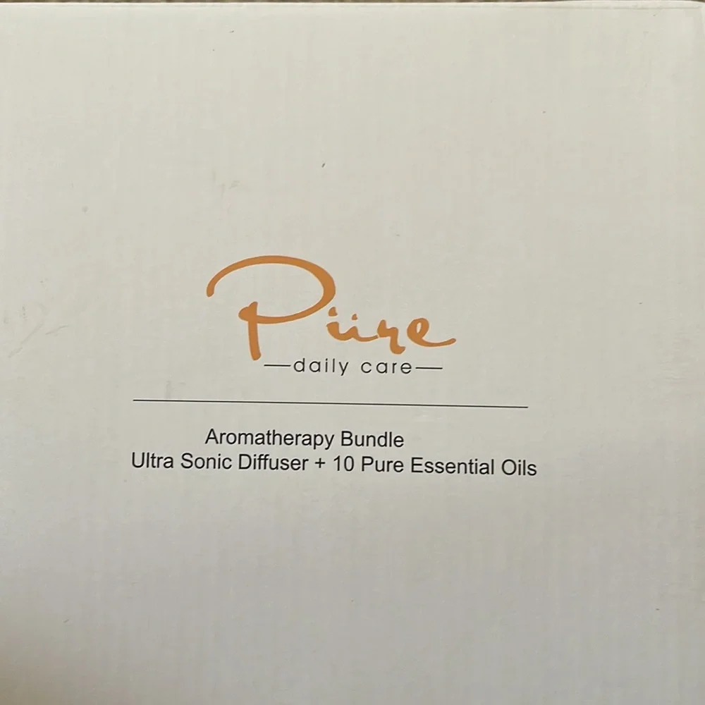NIB Pure Daily Care Ultrasonic Aromatherapy Diffuser with 10 Pure Essential Oils